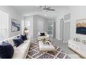 Bright living room with neutral walls, modern furnishings, and stylish decor at 10728 Navigation Dr, Riverview, FL 33579