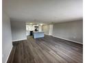 Open floor plan with kitchen featuring updated appliances and island at 12801 College Hill Dr, Hudson, FL 34667