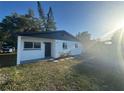 Charming single-story home with a fresh white exterior and green lawn at 342 51St N Ave, St Petersburg, FL 33703