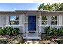 Close-up of a blue front door and stylish details of the home's exterior at 3510 4Th N Ave, St Petersburg, FL 33713