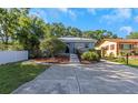 The property boasts a beautifully landscaped yard, showcasing meticulous care and attention to detail at 403 Saint Petersburg W Dr, Oldsmar, FL 34677