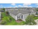 A home features a lush lawn and landscaping at 4224 Crayford Ct, Land O Lakes, FL 34638