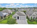 Charming single-Gathering home features well-manicured lawn, paver driveway and neutral color palette at 4224 Crayford Ct, Land O Lakes, FL 34638