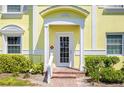 Charming yellow condo building with classic architectural details, well-maintained landscaping at 4740 Beach Se Dr # A, St Petersburg, FL 33705