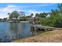 Waterfront view showcasing the dock and boat lift, great for accessing the open water at 4790 Shore Acres Ne Blvd, St Petersburg, FL 33703