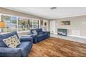 Inviting living room featuring wood tile flooring, comfortable seating, and abundant natural light at 742 45Th Ne Ave, St Petersburg, FL 33703