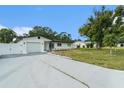 Attractive single-story home featuring a new driveway and well-kept landscaping at 11350 112Th Ave, Largo, FL 33778