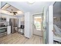 Modern kitchen boasting stainless steel appliances and sleek countertops, next to a bright living space at 11720 Park Blvd # 301, Seminole, FL 33772