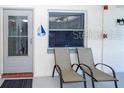 Comfortable outdoor patio with stylish seating, enhancing the relaxation and enjoyment of this condo at 11720 Park Blvd # 301, Seminole, FL 33772