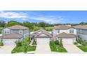 Inviting single-Gathering homes featuring two-car garages, well-maintained lawns, and lush greenery at 20659 Drake Elm Dr, Land O Lakes, FL 34638