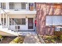 Exterior shot of the building featuring red brick and stairway access to the apartment entrance at 2366 Shelley St # 7, Clearwater, FL 33765