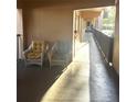 Inviting hallway with comfortable patio seating just outside the unit at 2525 W Bay Dr # A20, Belleair Bluffs, FL 33770