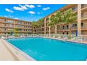 Large community pool with plenty of space to lounge and relax by the water at 2525 W Bay Dr # A20, Belleair Bluffs, FL 33770