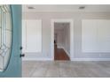 Light-filled entryway with neutral tile flooring and views of the adjacent rooms, adding depth at 302 W Hilda St, Tampa, FL 33603