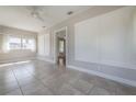 Open-concept living space with tile floors and a glimpse into the adjacent rooms at 302 W Hilda St, Tampa, FL 33603