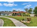 Beautiful home with well manicured lawn and walkway at 3092 Hillside Ln, Safety Harbor, FL 34695