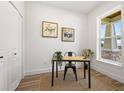 Bright office space with white walls, wood-look floors, closet, and a charming window view at 3505 N Dartmouth Ave, Tampa, FL 33603