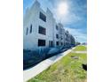 Exterior view of a townhome in the early stages of construction, showing scaffolding and block framework at 4723 W Price Ave # 2, Tampa, FL 33611