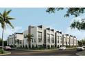 Modern townhomes with large windows and rooftop terraces enhancing the street view of the community at 4723 W Price Ave # 2, Tampa, FL 33611