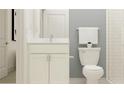 A well lit bathroom with a vanity, toilet, and shower at 6849 E 115Th St, Palmetto, FL 34221