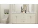 Bathroom featuring a double sink vanity and a toilet at 6849 E 115Th St, Palmetto, FL 34221