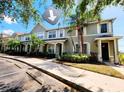 Charming townhome featuring a well-maintained facade with lush landscaping and ample parking at 8796 Christie Dr, Largo, FL 33771