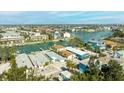 Aerial view of a waterfront property with canal access and lush tropical landscaping at 12412 Lagoon Ln, Treasure Island, FL 33706