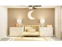 Bright Bedroom with neutral toned walls, featuring a crib, decorations, and dual dressers at 12605 Aura Moonlight Ter, Parrish, FL 34219
