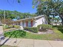 Inviting one-story home with well-manicured lawn and lush green landscaping at 1535 Nursery Rd # 107, Clearwater, FL 33756