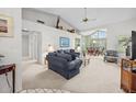 Spacious living room featuring high ceilings and a combined living and dining space at 235 Woodridge Cir, Oldsmar, FL 34677
