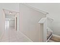 Bright hallway features tile floors and leads to multiple rooms at 7205 Ronnie Gardens Ct, Tampa, FL 33619