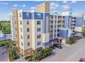 Attractive low-angle exterior view of condos featuring multiple levels and balconies, in a landscaped setting at 960 Starkey Rd # 7202, Largo, FL 33771