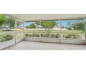 Relaxing screened lanai offers a serene view of the spacious, private backyard at 12124 Colonial Estates Ln, Riverview, FL 33579