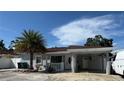 View of single story home with carport and front yard at 2117 W Clifton St, Tampa, FL 33603