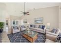 Cozy living room featuring vaulted ceilings, comfortable seating, and stylish decor at 26180 Deep Creek Blvd, Punta Gorda, FL 33983