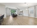 Bright and open living room featuring wood flooring and lots of natural light at 304 Shell Manor Dr, Ruskin, FL 33570