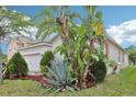An expansive yard featuring lush greenery, mature trees, and well-kept landscaping at 304 Shell Manor Dr, Ruskin, FL 33570