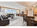 Bright living room with floor-to-ceiling windows offering panoramic views and comfortable leather seating at 31 Island Way # 505, Clearwater Beach, FL 33767