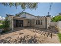 White home featuring a secure gated area at 3212 W Arch St, Tampa, FL 33607
