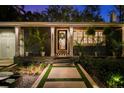 Charming single-story home with meticulous landscaping, an inviting front entrance, and a stone entryway at 3505 W Kensington Ave, Tampa, FL 33629