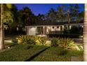 Single story home with lush landscaping, stone driveway, and manicured lawn at 3505 W Kensington Ave, Tampa, FL 33629