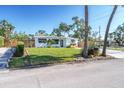 Inviting single-story home with a pristine lawn and a cozy, well-kept garden at 4001 W North A St, Tampa, FL 33609