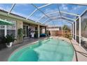 Inviting in-ground pool with screened enclosure, a perfect outdoor oasis for relaxation and entertainment at 4017 3Rd E Ave, Bradenton, FL 34208