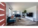 Bright and open living room featuring a cozy seating area and modern decor, creating an inviting atmosphere at 4311 W Oklahoma Ave, Tampa, FL 33616