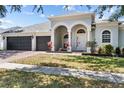 Charming home with a spacious three car garage and a brick paved driveway at 4809 Walnut Ridge Rd, Land O Lakes, FL 34638