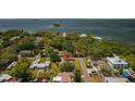 An aerial view of the property showcasing its location within a residential neighborhood near the water at 624 Orange St, Palm Harbor, FL 34683