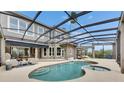 Beautiful in-ground pool is perfect for relaxing and entertaining in this home's outdoor living area at 6301 Marbella Blvd, Apollo Beach, FL 33572