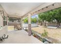 A covered patio overlooks an above-ground pool and large backyard, perfect for outdoor entertaining at 831 72Nd N Ave, St Petersburg, FL 33702
