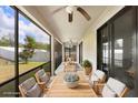 Inviting screened patio with ceiling fan and stylish seating area perfect for relaxation and outdoor dining at 1214 Florablu Dr, Seffner, FL 33584