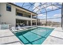 Beautiful backyard pool and patio area perfect for outdoor entertaining and relaxation at 14507 Woodland Spur Dr, Lithia, FL 33547